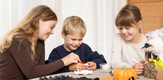 Collage picture - Children make Halloween decorations