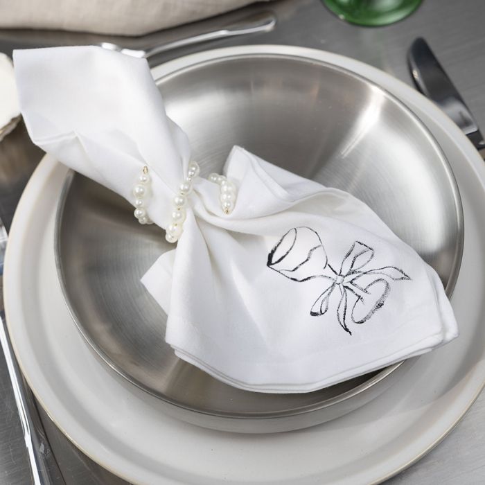 Decorated napkin with a festive napkin ring
