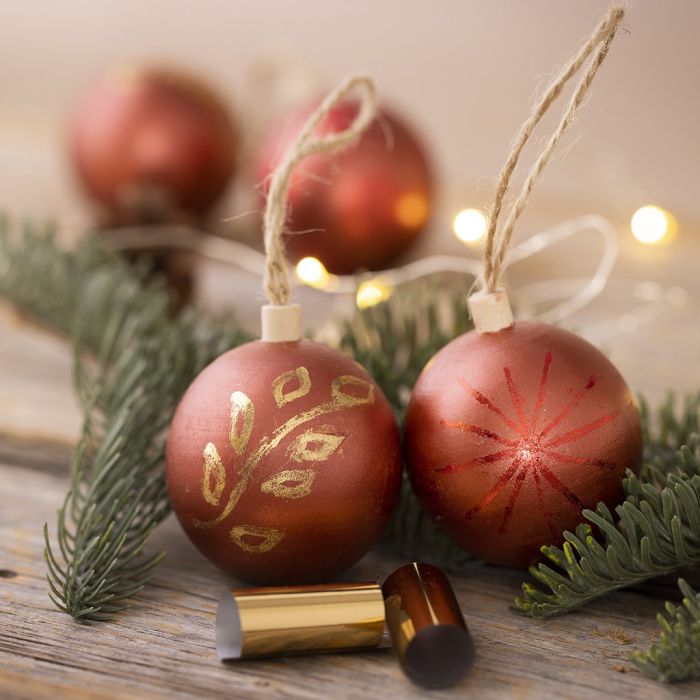 Christmas baubles decorated with craft paint and deco foil