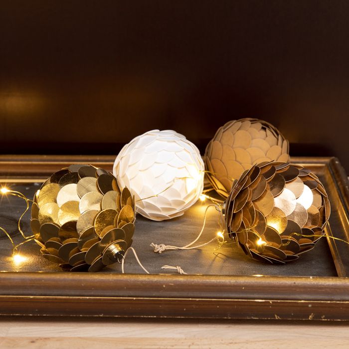 A Christmas Bauble with Faux Leather Paper made to look like a Cone
