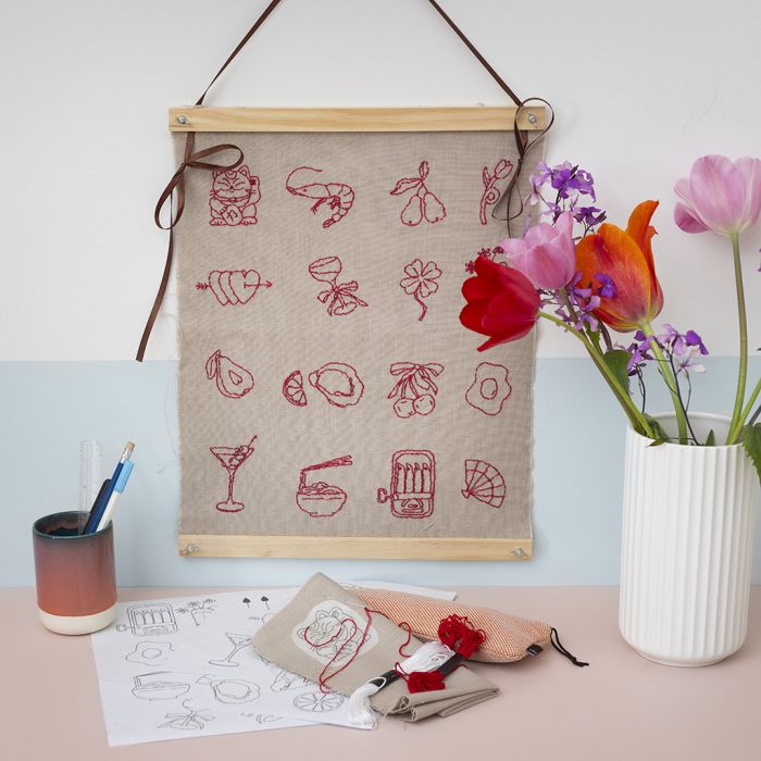 Wall hanger with embroidered designs