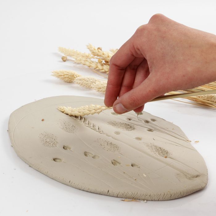 How to make imprints of flowers in self-hardening clay