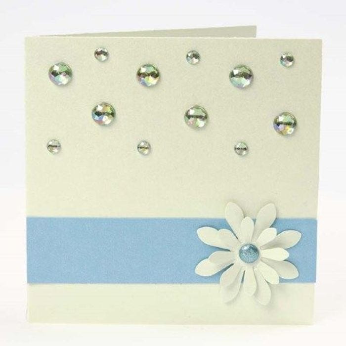 A Greeting Card with a Border, a punched-out Flower & Rhinestones