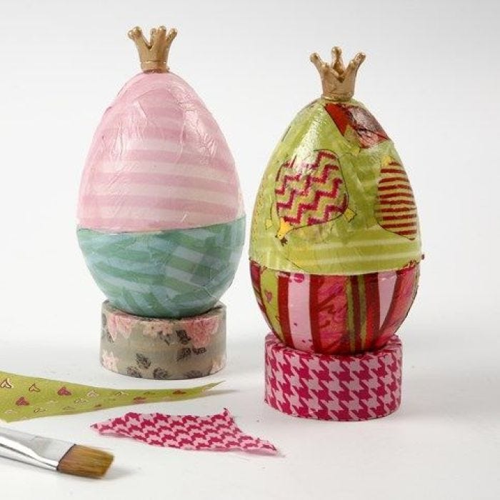 A mounted Decoupaged Egg with a Gold Crown