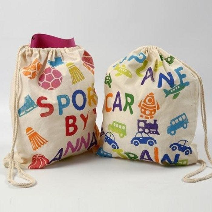 A Shoe Bag with stamped Designs and Text