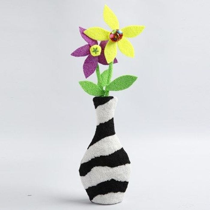 A decorated Papier-Mâché Vase with Foam Clay Flowers