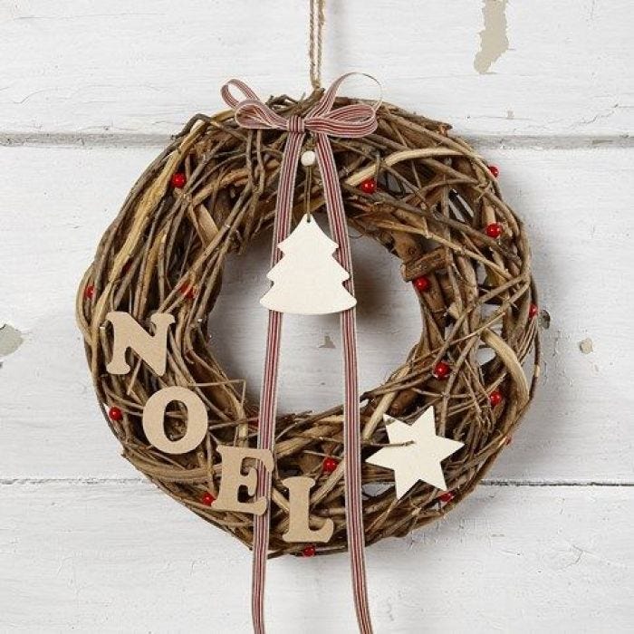 A Garland made from natural Twigs with wooden Decorations & a Bow