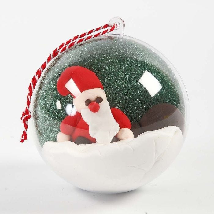 A Decorative Bauble with a Landscape and a Figure inside