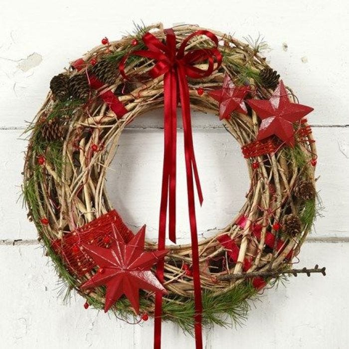 A natural Wreath with red Decorations