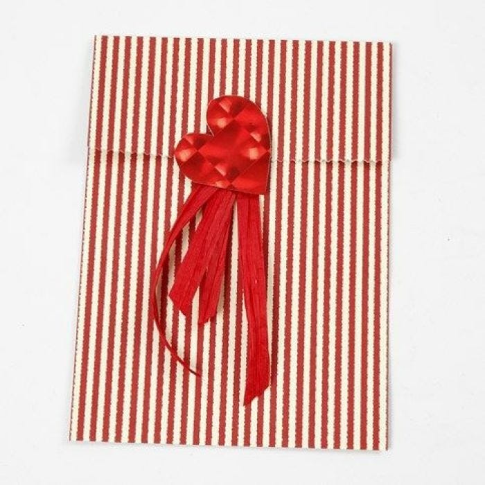 A Foil Heart and Gift Ribbon on a Vivi Gade Design Paper Bag