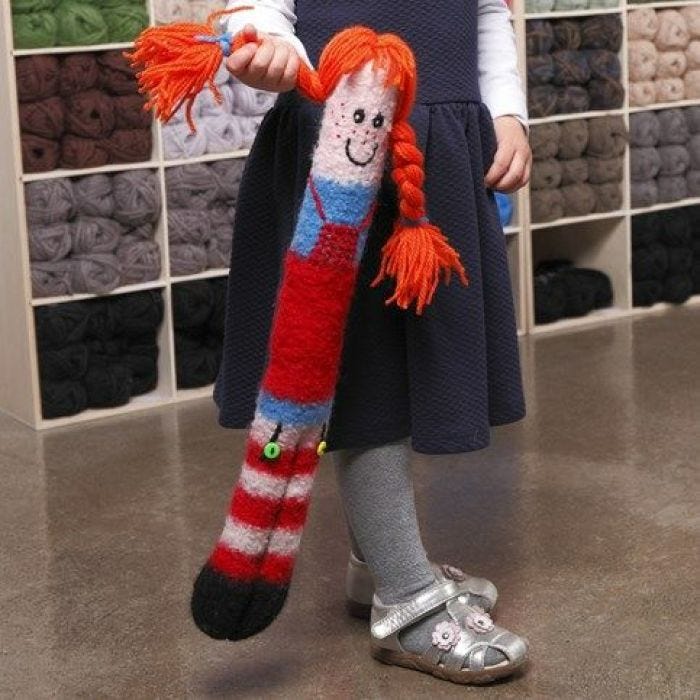 A long knitted and felted cuddly Doll