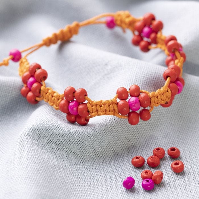 Braided Bracelet from Cotton Cord with Beads shaped like Flowers