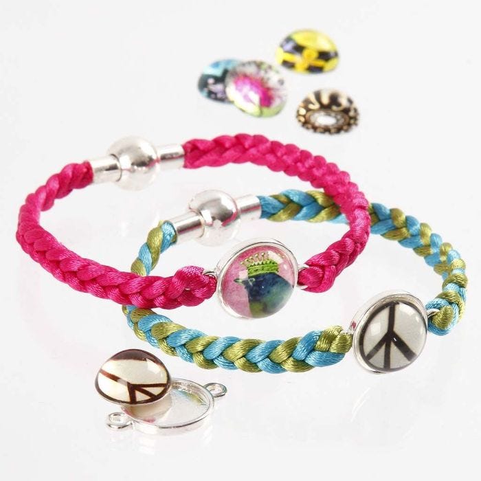 A Bracelet from 4 plaited Satin Cords & a Cabochon in the Middle