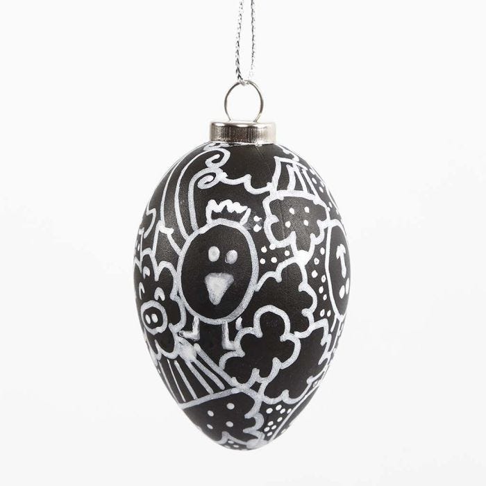 A black Egg with white Doodle Drawing