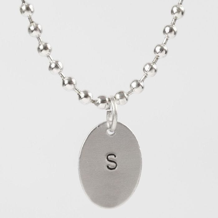 A Pendant stamped with a Capital Letter