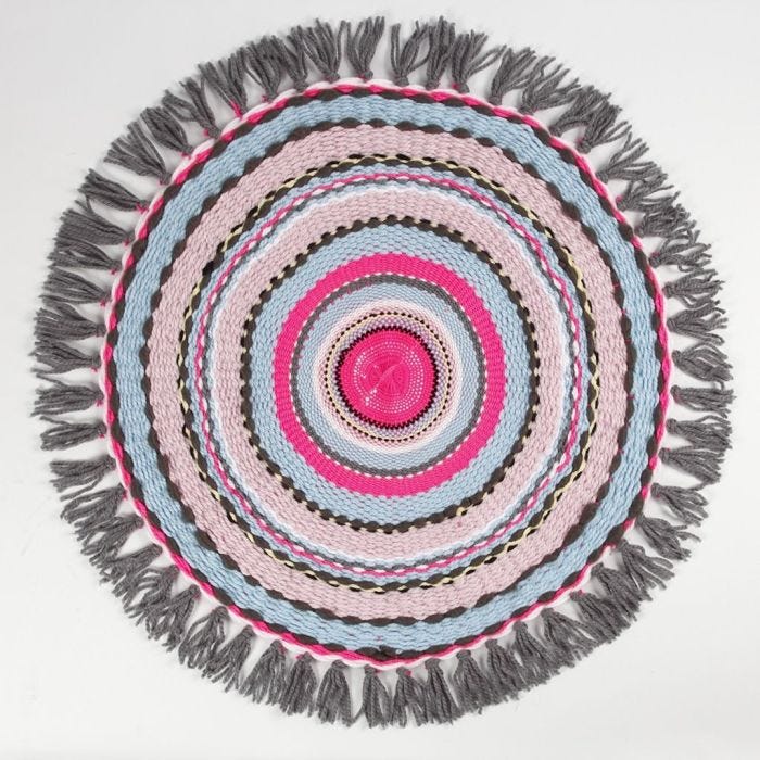 A small Rug woven on a circular Loom