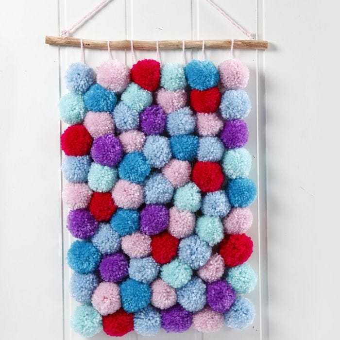 A Wall Hanging made from Pom-poms