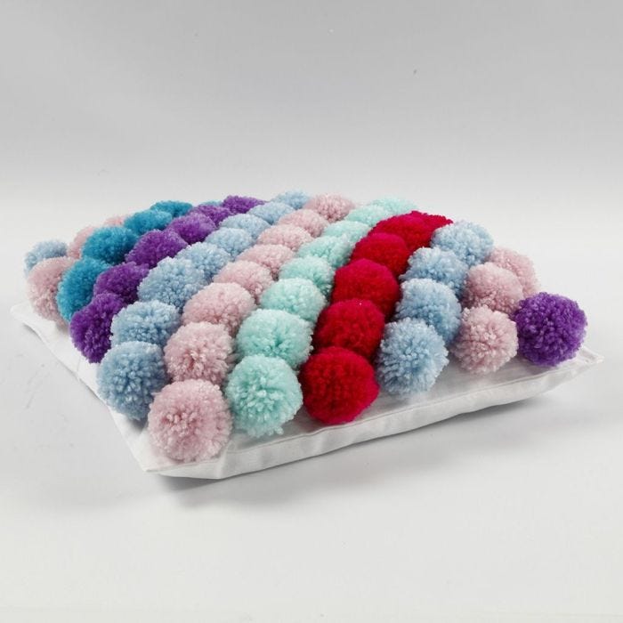 A Cushion Cover made from Pom-poms