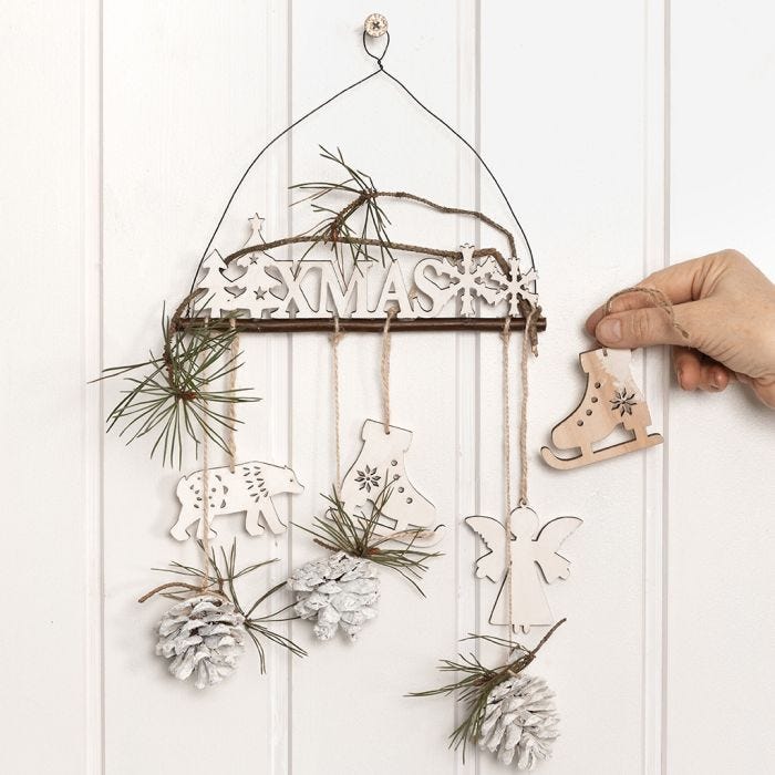 A wooden Door Decoration with Spruce and Cones