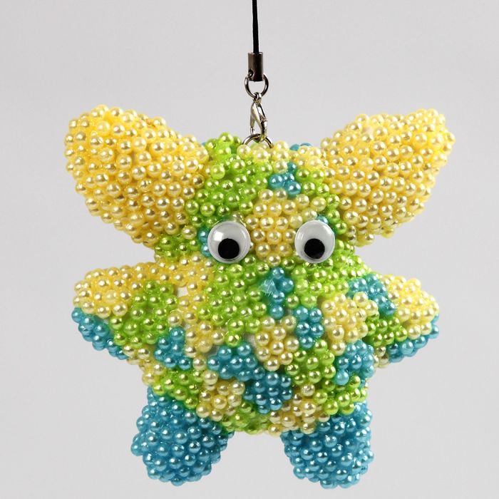 A Fabric Figure covered with Pearl Clay and Googly Eyes