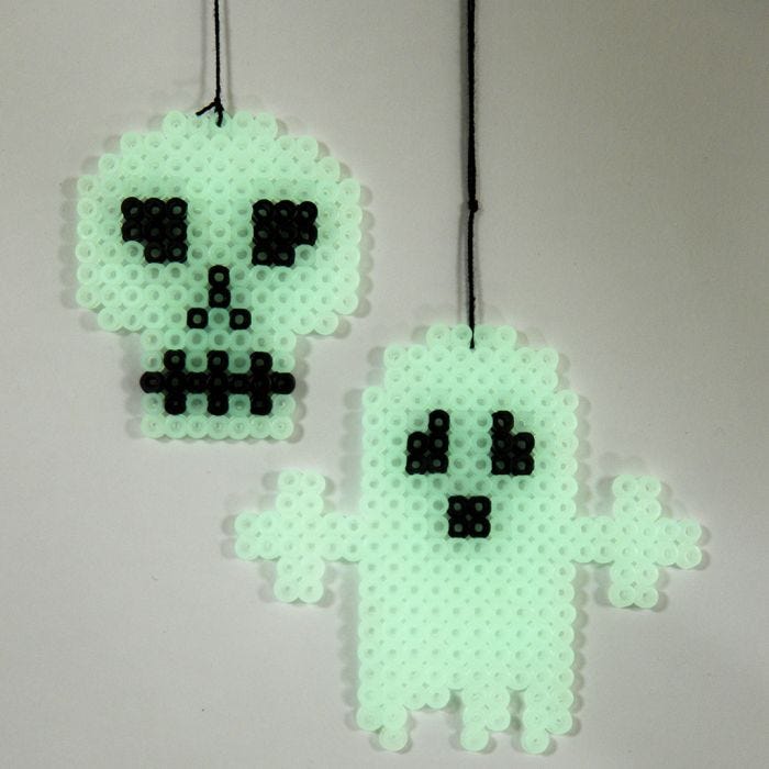 A luminescent Ghost and Skull made on a Pegboard