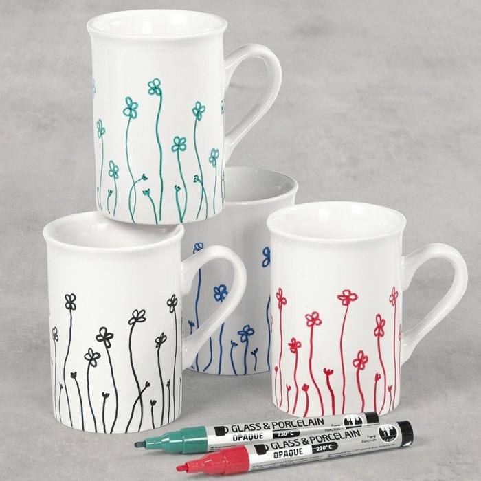 Porcelain mugs decorated with flowers drawn with glass & porcelain markers