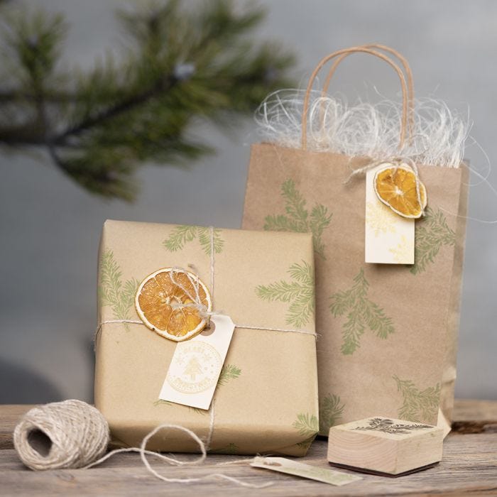 Gift wrapping with stamped designs and natural materials