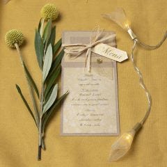 A menu card from recycled card decorated with a skeleton leaf