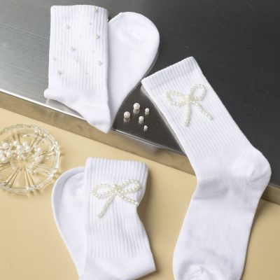 Socks decorated with wax beads