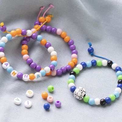 Bracelets made from coloured Elastic Cord and Plastic Beads