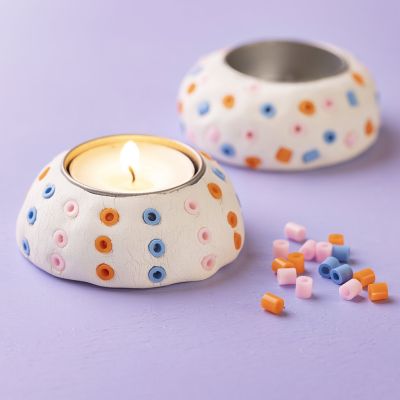 Candle holders in self-hardening clay with fused beads 