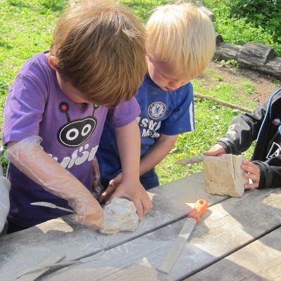 Children working with Soapstone