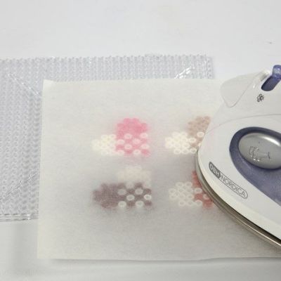 A Manilla Tag decorated with a Nabbi Bead Heart