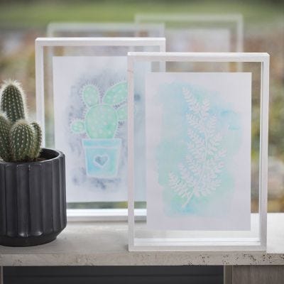 A Picture with Drawing Gum Designs and Aqua Paint in a double-sided Frame