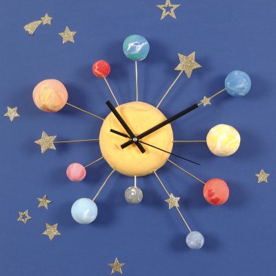 A Wall Clock decorated with Silk Clay Planets