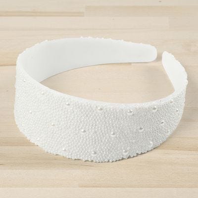 A hair band decorated with mini glass beads and half-pearls