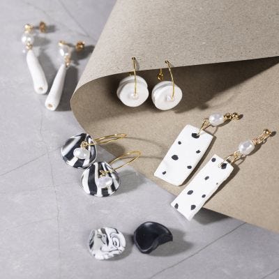 Earrings made with jewellery clay and pearlescent white beads