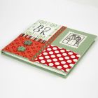 A Notebook covered with a Collage made from organic Cotton
