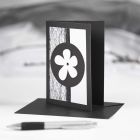 A black Greeting Card with black and white Decorations