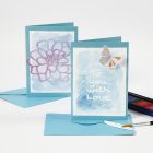 A Greeting Card and a Place Card with Drawing Gum Text painted over with Watercolours