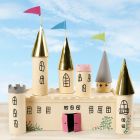 A fairytale castle from a cardboard box and cardboard tubes decorated with craft paint
