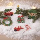 Christmas car, Christmas tree, wreath, elf and gift, all made with BioBeads