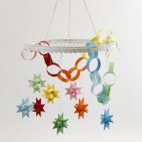 A Metal Loop with coloured Woven Stars and a Paper Chain