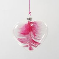 A Feather inside a Glass Heart hanging in a neon-coloured String