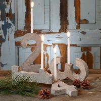 An Advent Candle Holder made from four Concrete Numbers