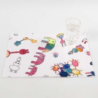 A Fabric Placemat with coloured-in Designs