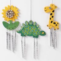 Painted Wind Chimes decorated with wooden Discs and graphic Designs