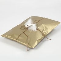 Gift Wrapping with gold Tissue Paper
