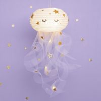 A Jellyfish from a Rice Paper Lamp and Tulle decorated with Stickers