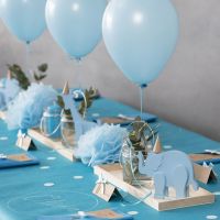 Decorations for a Christening with wooden Animals, folded Napkins, Menu Cards, Pom-poms and Helium Balloons
